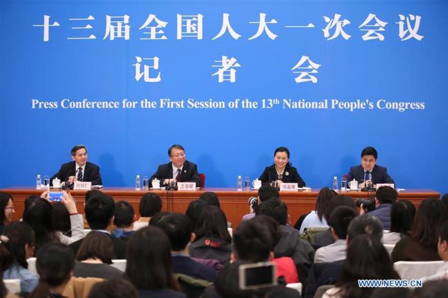 Shen Chunyao (2nd L), secretary of the Bill Group of Secretariat of the first session of the 13th National People's Congress (NPC) and chairman of the Legislative Affairs Commission of the NPC Standing Committee, and Zheng Shuna (2nd R), deputy secretary of the Bill Group of Secretariat of the first session of the 13th NPC and vice chairperson of the Legislative Affairs Commission of the NPC Standing Committee, take questions at a press conference on an amendment to the country's Constitution in Beijing, capital of China, March 11, 2018.[Photo: Xinhua]