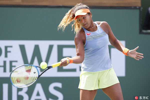 Naomi Osaka of Japan returns a shot against Daria Kasatkina of Russia during the women's final of the BNP Paribas Open at the Indian Wells Tennis Garden in Indian Wells, California, U.S., on March 18, 2018. [Photo: Imagine China]
