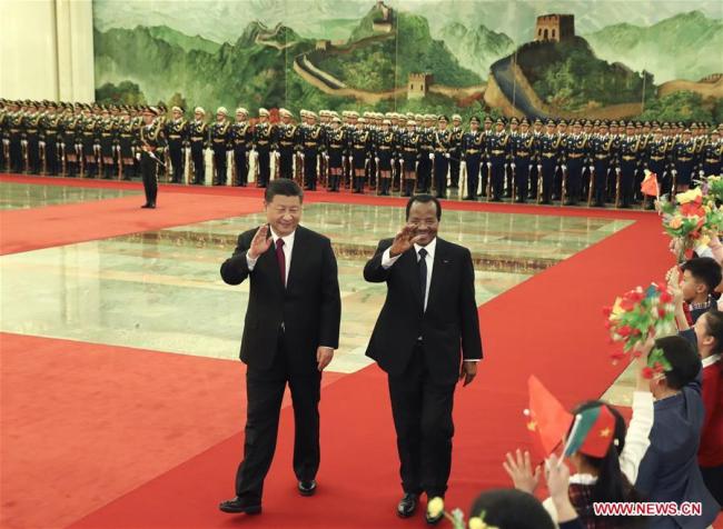 Chinese President Xi Jinping (L) holds a welcome ceremony for visiting Cameroonian President Paul Biya before their talks at the Great Hall of the People in Beijing, capital of China, March 22, 2018. [Photo: Xinhua/Pang Xinglei]