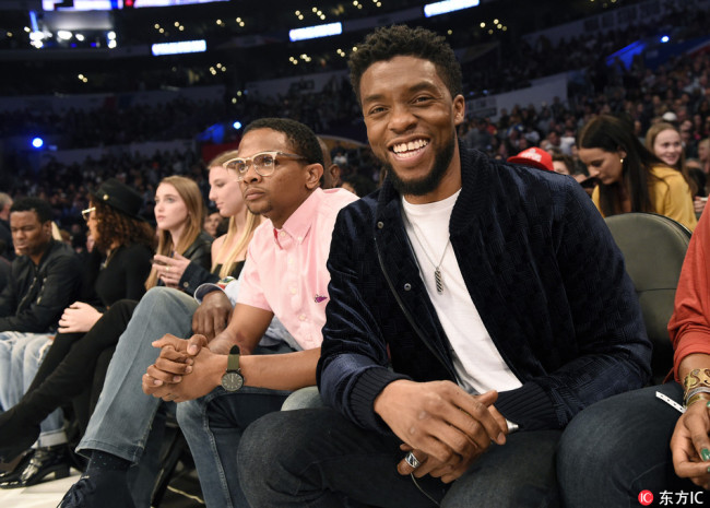 Actor Chadwick Boseman, star of the film "Black Panther" poses for a photo before the start of the NBA All-Star basketball game on Feb. 18 2018, in Los Angeles.  [Photo: from IC]
