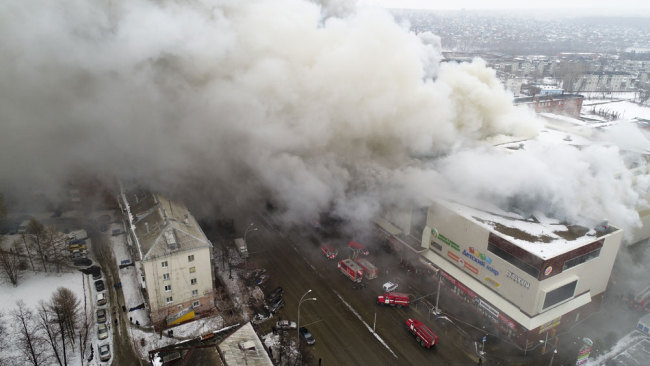 In this Russian Emergency Situations Ministry photo, on Sunday, March 25, 2018, smoke rises above a multi-story shopping center in the Siberian city of Kemerovo, about 3,000 kilometers (1,900 miles) east of Moscow, Russia. At least three children and a woman have died in a fire that broke out in a multi-story shopping center in the Siberian city of Kemerovo.[Photo: AP]