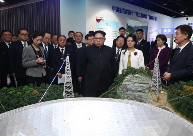 Kim Jong Un, chairman of the Workers' Party of Korea (WPK) and chairman of the State Affairs Commission of the Democratic People's Republic of Korea (DPRK), visits an exhibition showcasing the innovation achievements of the Chinese Academy of Sciences since the 18th National Congress of the Communist Party of China (CPC). At the invitation of Xi Jinping, general secretary of the Central Committee of the CPC and Chinese president, Kim paid an unofficial visit to China from March 25 to 28. During the visit, Xi held talks with Kim at the Great Hall of the People in Beijing. [Photo: Xinhua/Yao Dawei]