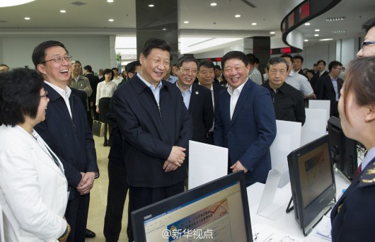 Chinese President Xi Jinping visits the China (Shanghai) Pilot Free Trade Zone in May 2014. [Photo: Xinhua]