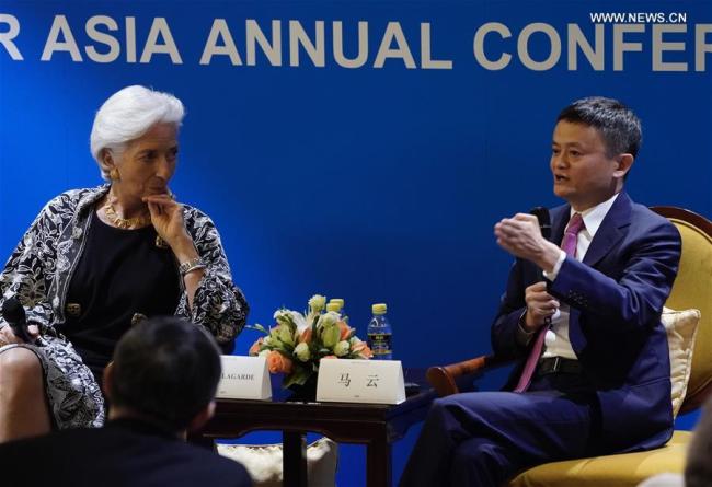 Jack Ma, founder and chairman of Chinese e-commerce giant Alibaba Group, talks with International Monetary Fund Managing Director Christine Lagarde in Boao, south China's Hainan Province, April 9, 2018. They are here to attend the Boao Forum for Asia annual conference. [Photo: Xinhua]