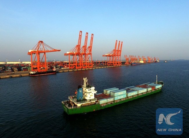 A cargo ship departing from a dock at the bonded port area of Qinzhou, south China's Guangxi Zhuang Autonomous Region.