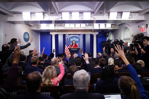 Reporters raise their hands to ask a question of White House press secretary Sarah Huckabee Sanders during the daily press briefing at the White House, Wednesday, March 28, 2018, in Washington.[File Photo: AP]