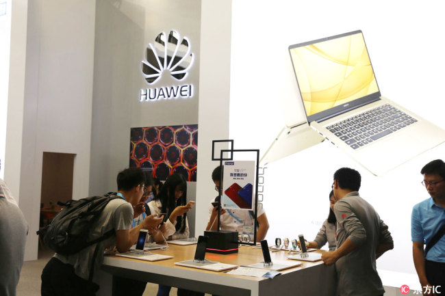 People visit the Huawei stall at the 2017 International Consumer Electronics Show Asia in Shanghai, China, on Wednesday, June 7, 2017. [Photo: IC]