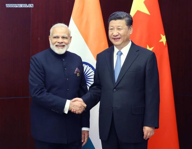 Chinese President Xi Jinping (R) meets with Indian Prime Minister Narendra Modi in Astana, Kazakhstan, June 9, 2017. [Photo: Xinhua/Yao Dawei]