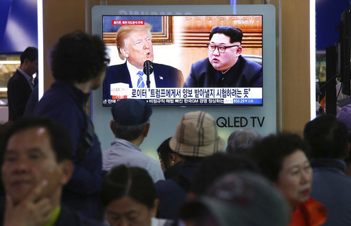 People watch a TV screen showing file footage of U.S. President Donald Trump, left, and North Korean leader Kim Jong Un during a news program at the Seoul Railway Station in Seoul, South Korea, Wednesday, May 16, 2018. [File photo: AP]