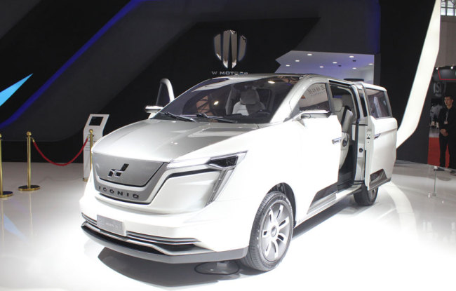 Automaker ICONIQ displays its latest new energy MPV vehicle, May 17, 2018, at the ongoing World Exhibition of Intelligent Technology in Tianjin. [Photo: China Plus]