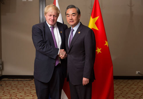 Chinese State Councilor and Foreign Minister Wang Yi meets with his British counterpart Boris Johnson on the sidelines of the G20 foreign ministers' conference in Buenos Aires on Monday. [Photo: fmprc.gov.cn]