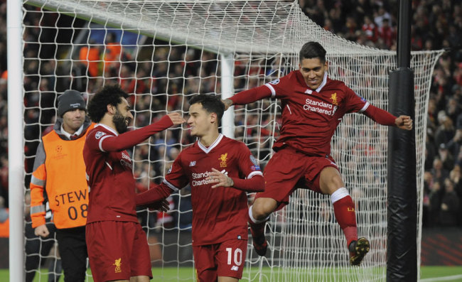 Liverpool's Philippe Coutinho, center, celebrates with his teammates after scoring his side's fifth goal during the Champions League Group E soccer match between Liverpool and Spartak Moscow at Anfield, Liverpool, England, Wednesday, Dec. 6, 2017. [Photo: AP]