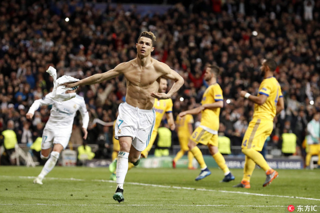 Cristiano Ronaldo celebrates Real Madrid's progression at the UEFA Champions League quarter final match between Real Madrid and Juventus FC at the Santiago Bernabeu stadium on April 11, 2018. [Photo: IC]