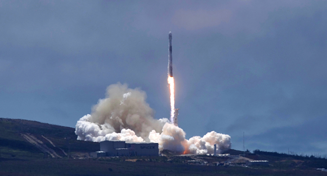 A SpaceX Falcon 9 rocket carrying two U.S.-German science satellites and five commercial communications satellites blasts off from Vandenberg Air Force base on the central California coast Tuesday afternoon, May 22, 2018. The science payload from NASA and the German Centre for Geosciences includes two identical satellites for the Gravity Recovery and Climate Experiment. [Photo: AP/Matt Hartman]