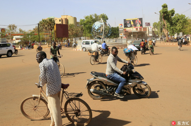Commuters go about their daily routine at the United Nations Square in Ouagadougou, Burkina Faso, 06 March 2018. [Photo: IC]