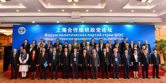 Delegates attending the first Shanghai Cooperation Organization (SCO) Political Parties Forum pose for a group photo before the forum in Shenzhen, south China's Guangdong Province, May 26, 2018. [Photo: Xinhua]