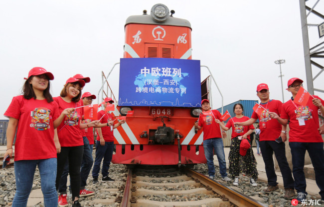 The first cross-border e-commerce freight train launched by JD Logistics of Chinese online retailer JD.com linking Xi'an with Hamburg of Germany is pictured after arriving at a terminal station in Xi'an city, northwest China's Shaanxi province, May 21, 2018.[Photo: dfic.cn]