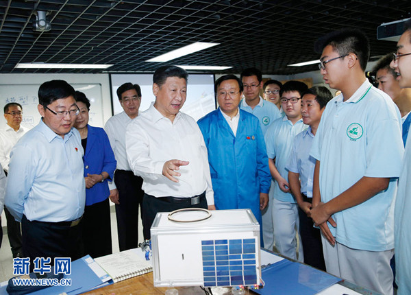 President Xi Jinping visit Beijing Bayi School on September 9, 2016 to learn about the small satellite developed by school's teachers and students. [Photo: Xinhua]