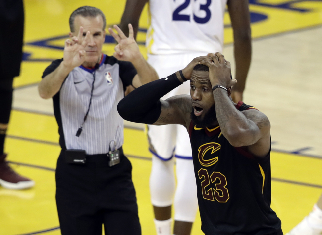 Cleveland Cavaliers forward LeBron James (23) reacts to a call during the second half of Game 1 of basketball's NBA Finals between the Golden State Warriors and the Cavaliers in Oakland, Calif., Thursday, May 31, 2018. [Photo: AP/Marcio Jose Sanchez]