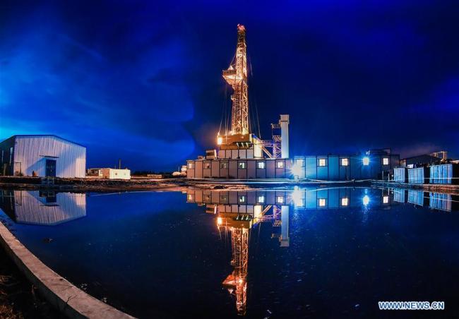 The Crust 1 land-based drilling rig system is seen at night in the Songliao Basin in northeast China, June 1, 2018. [Photo: Xinhua]
