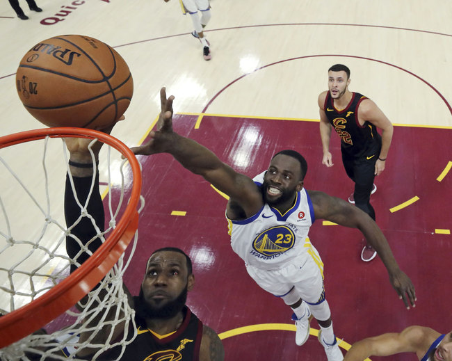 Cleveland Cavaliers' LeBron James shoots as Golden State Warriors' Draymond Green defends during the first half of Game 3 of basketball's NBA Finals, Wednesday, June 6, 2018, in Cleveland. [Photo: AP]