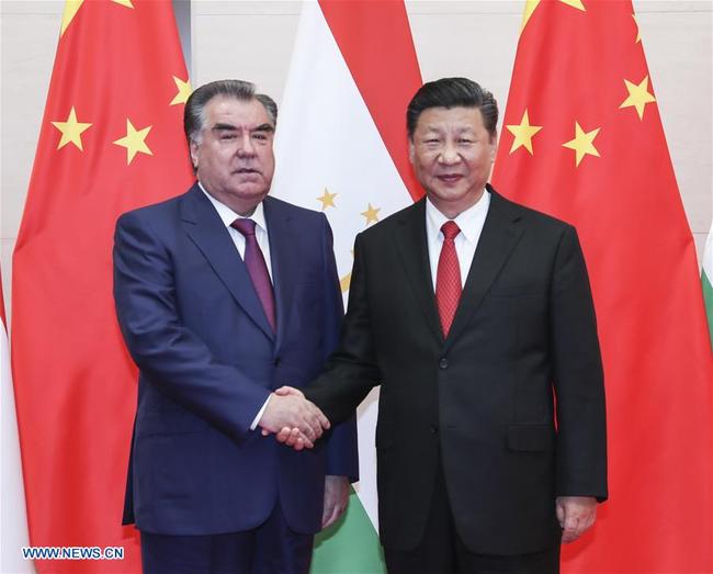 Chinese President Xi Jinping (R) meets with his Tajik counterpart Emomali Rahmon in Qingdao, east China's Shandong Province, June 9, 2018. [Photo: Xinhua/Xie Huanchi]