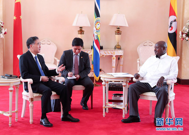 Head of China's top political advisory body Wang Yang (L) meets with Ugandan President Yoweri Museveni (R) in Uganda on Friday, June 15, 2018. [File photo: Xinhua]