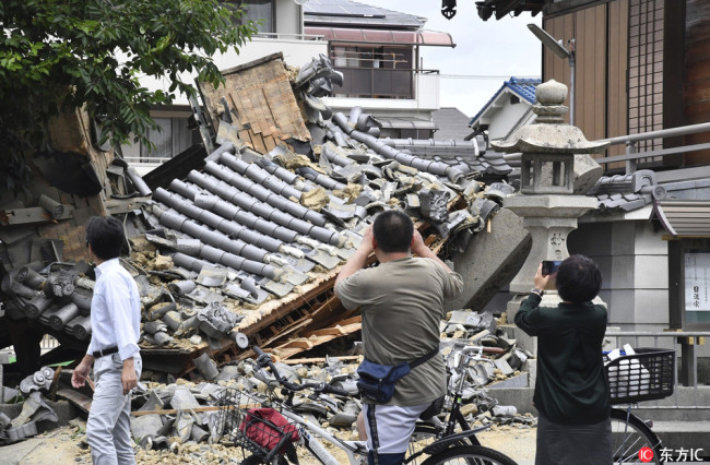 Myotokuji temple is destroyed by an earthquake registering a weak 6 on the Japanese seismic scale in Ibaraki City, the north side of Osaka Prefecture on June 18, 2018. [Photo: IC]
