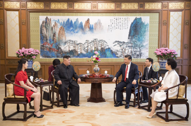 Xi Jinping (2nd R), general secretary of the Central Committee of the Communist Party of China and Chinese president, and his wife Peng Liyuan (1st R) meet with Kim Jong Un (2nd L), chairman of the Workers' Party of Korea and chairman of the State Affairs Commission of the Democratic People's Republic of Korea (DPRK), and his wife Ri Sol Ju at the Diaoyutai State Guesthouse in Beijing on Wednesday, June 20, 2018. [Photo: Xinhua]