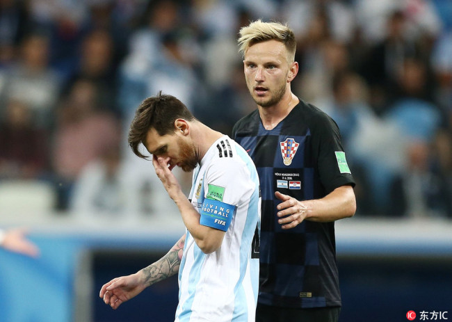 Lionel Messi of Argentina looks dejected in front of Ivan Rakitic of Croatia,Russia. [Photo: IC]