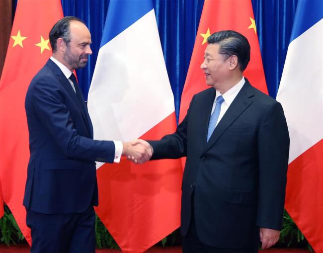 Chinese President Xi Jinping (R) meets with French Prime Minister Edouard Philippe in Beijing, capital of China, June 25, 2018.[Photo: Xinhua]