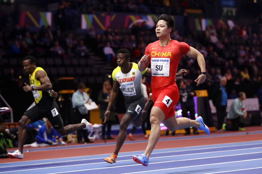 China's Su Bingtian competes in a heat of the men's 60 meters race at the World Athletics Indoor Championships in Birmingham, Britain, Saturday, March 3, 2018. [Photo: AP]