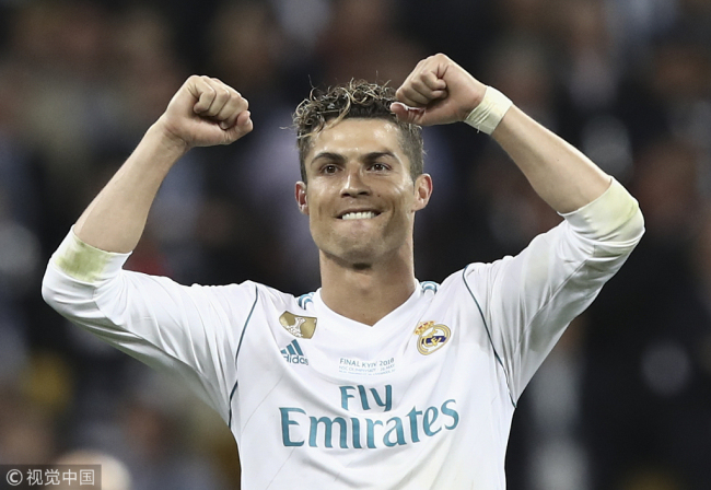 In this file photo taken on May 26, 2018 Real Madrid's Portuguese forward Cristiano Ronaldo celebrates after winning the UEFA Champions League final football match between Liverpool and Real Madrid at the Olympic Stadium in Kiev, Ukraine on May 26, 2018. Real Madrid announced on July 10, 2018 the transfer of Cristiano Ronaldo to Italy's Juventus, with the Portuguese superstar saying the time had come "for a new stage" in his life. [File Photo: VCG]