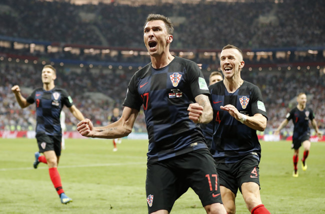 Croatia's Mario Mandzukic celebrates after scoring his side's second goal during the semifinal match between Croatia and England at the 2018 soccer World Cup in the Luzhniki Stadium in Moscow, Russia, Wednesday, July 11, 2018. [Photo: AP/Frank Augstein]