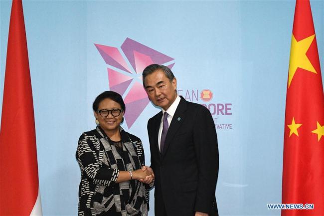 Chinese State Councilor and Foreign Minister Wang Yi (R) meets with Indonesian Foreign Minister Retno Marsudi in Singapore, Aug. 3, 2018. [Photo: Xinhua]