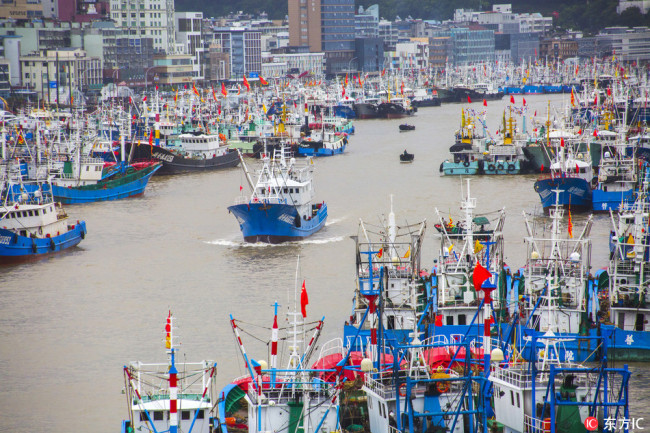 Fishing boats rest at port for safety in Zhoushan city, Zhejiang province ahead of the arrival of this year’s fourteenth typhoon. [Photo: IC]