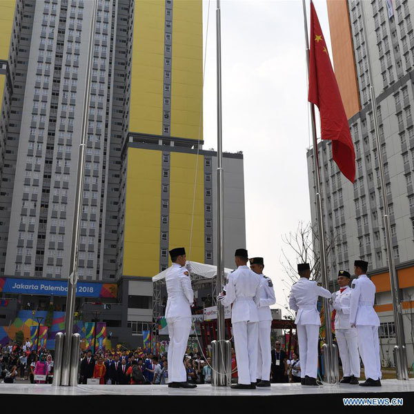 Chinese national flag is raised for Chinese delegation in the Asian Games Village ahead of the 18th Asian Games in Jakarta, Indonesia, on August 16, 2018. [Photo: Xinhua/Wang Yuguo]