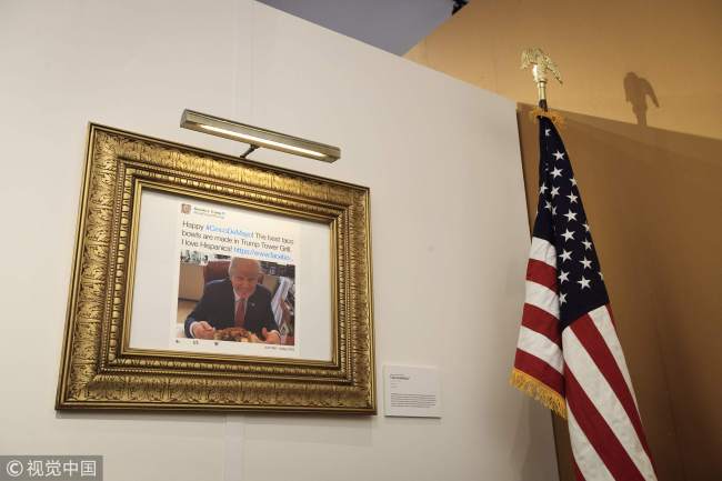 A Cinco de Mayo related tweet is displayed at The Daily Show-produced "Donald J. Trump Presidential Twitter Library" in New York City, June 16, 2017. [Photo：VCG]