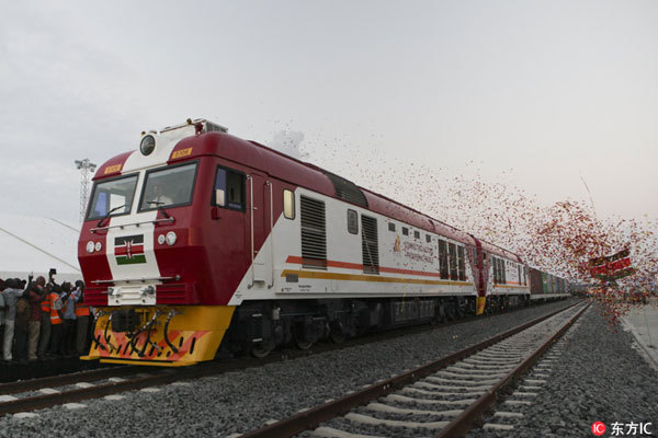 The new cargo train using the new Mombasa to Nairobi Standard Gauge Railway (SGR) that had been constructed by the China Road and Bridge Corporation (CRBC) and was financed by Chinese government, leaves the port after its official launching at Port Reitz in Mombasa, Kenya, May 30th, 2017. The newly constructed SGR is expected to enhance business between the two cities by providing fast and affordable means of transportation. [Photo: Imagine China]