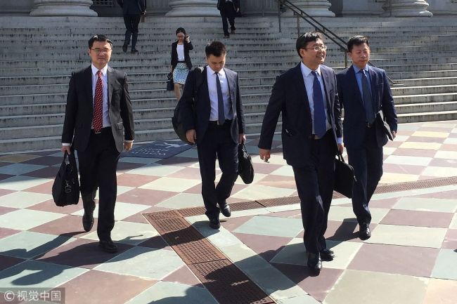 Members of a Chinese delegation led by the Vice Minister of Commerce and Deputy China International Trade Representative Wang Shouwen leave the building of the US Treasury after two days of talks with US representatives in Washington DC on August 23, 2018.[Photo: VCG]