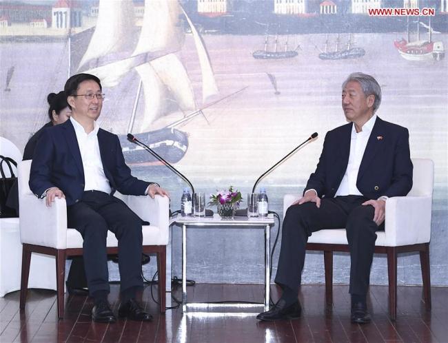 Chinese Vice Premier Han Zheng (L), also a member of the Standing Committee of the Political Bureau of the Communist Party of China (CPC) Central Committee, meets with Singaporean Deputy Prime Minister Teo Chee Hean in Singapore, Sept. 19, 2018. [Photo: Xinhua]