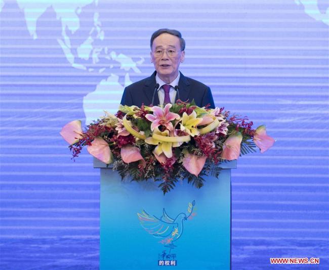 Chinese Vice President Wang Qishan delivers a keynote speech at the opening ceremony of a commemorative event for the International Day of Peace in Nanjing, capital of east China's Jiangsu Province, Sept. 19, 2018. [Photo: Xinhua]