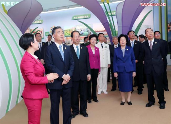 Wang Yang, a member of the Standing Committee of the Political Bureau of the Communist Party of China (CPC) Central Committee and chairman of the National Committee of the Chinese People's Political Consultative Conference (CPPCC), leading a central government delegation, visits an exhibition marking Ningxia Hui Autonomous Region's achievements made in the past 60 years in Yinchuan, northwest China's Ningxia Hui Autonomous Region, Sept. 19, 2018. [Photo: Xinhua]
