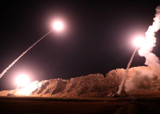 In this photo released on Monday, Oct. 1, 2018, by the Iranian Revolutionary Guard, missiles are fired from city of Kermanshah in western Iran targeting the Islamic State group in Syria. [Photo: Sepahnews via AP]