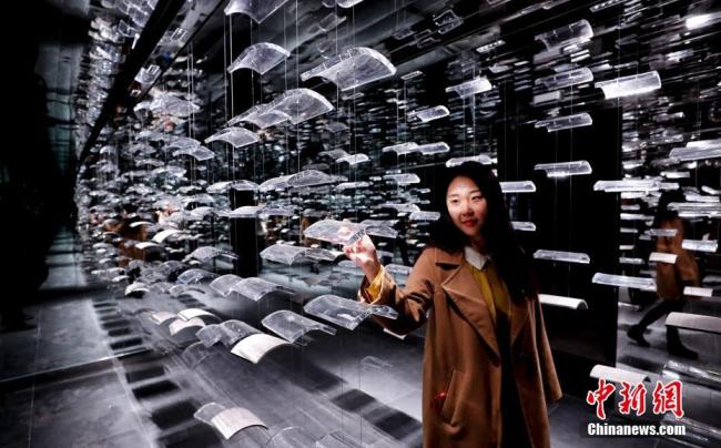 A tourist visits the hutong museum that opened on Thursday, October 18, 2018, in a historical district in central Beijing.[Photo: Chinanews.com]