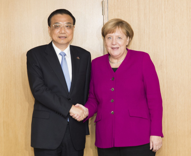 Chinese Premier Li Keqiang meets with German Chancellor Angela Merkel on the sidelines of the 12th Asia-Europe Meeting Summit in Brussels on Friday, October 19, 2018. [Photo: Xinhua]