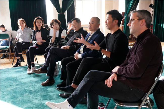 Zou Shuang, the new artistic director of the 21st Beijing Music Festival (2nd from left) attended a meeting with the cast of the new theatrical production "Farewell My Concubine" ahead of its opening on October 12, 2018. [Photo provided to China Plus]
