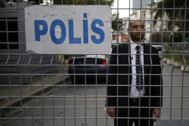 A security guard stands behind barriers blocking the road leading to Saudi Arabia's consulate in Istanbul, Saturday, Oct. 20, 2018. [Photo: AP/Emrah Gurel]