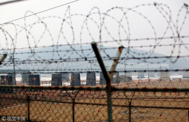 Heavy barbed wire fences guard the Freedom Bridge, connecting South Korea to the Demilitarized Zone (DMZ) and North Korea, near Seoul on January 29, 2013. [Photo: VCG]