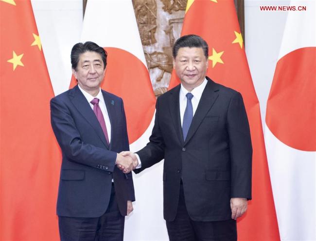 Chinese President Xi Jinping (R) meets with Japanese Prime Minister Shinzo Abe in Beijing, capital of China, Oct. 26, 2018. [Photo: Xinhua]